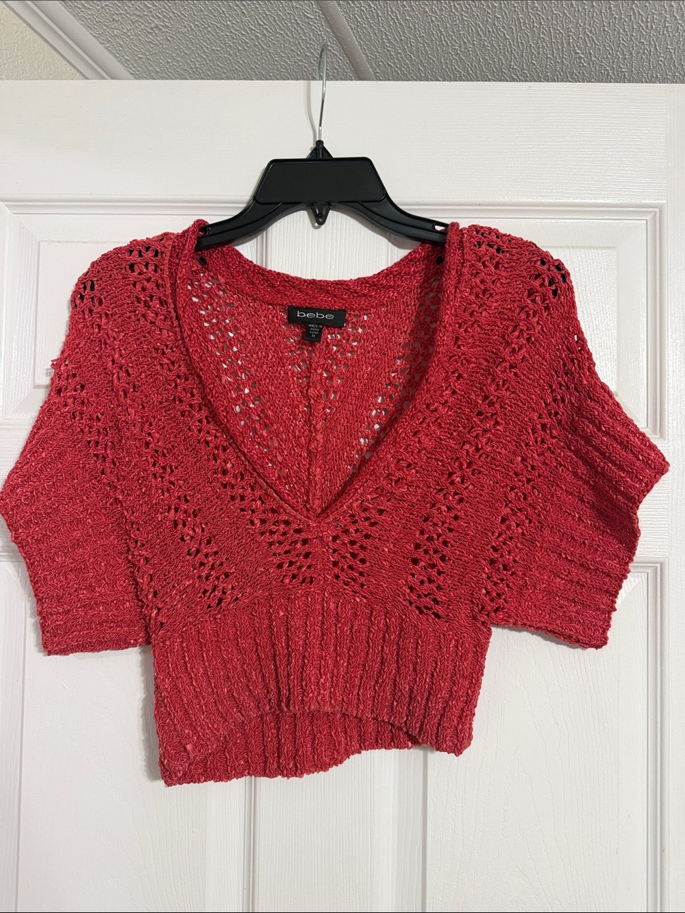 BEBE Red Cropped V‑Neck Open‑Knit Sweater